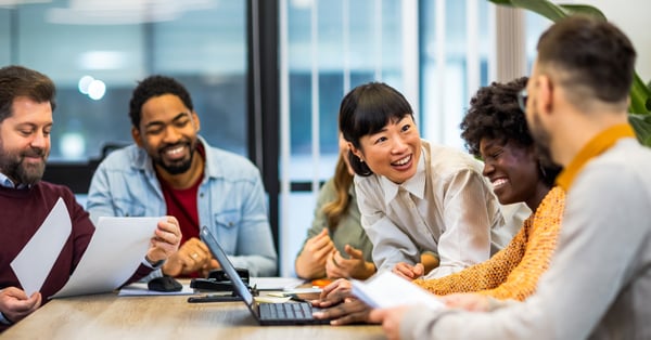 Multi-ethnic team in conversation during a team meeting